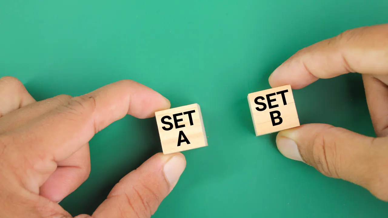 Hands holding Set A and Set B wooden blocks, illustrating A/B testing