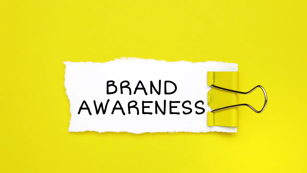 Brand Awareness note on a yellow background, illustrating brand awareness