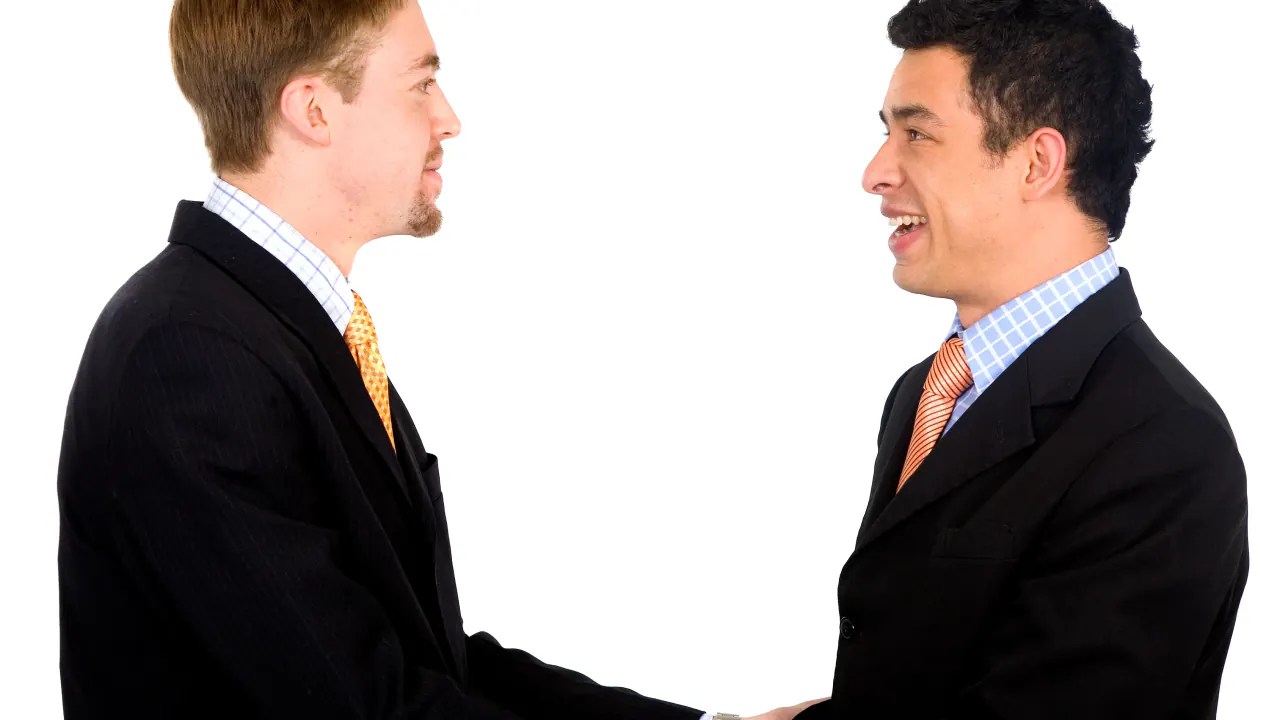 Two businessmen shaking hands, illustrating direct selling and how direct sales work