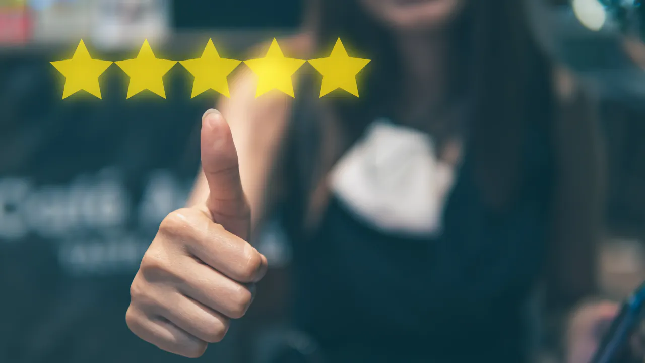 Thumbs up beside five gold stars, illustrating GenSales client and employee reviews