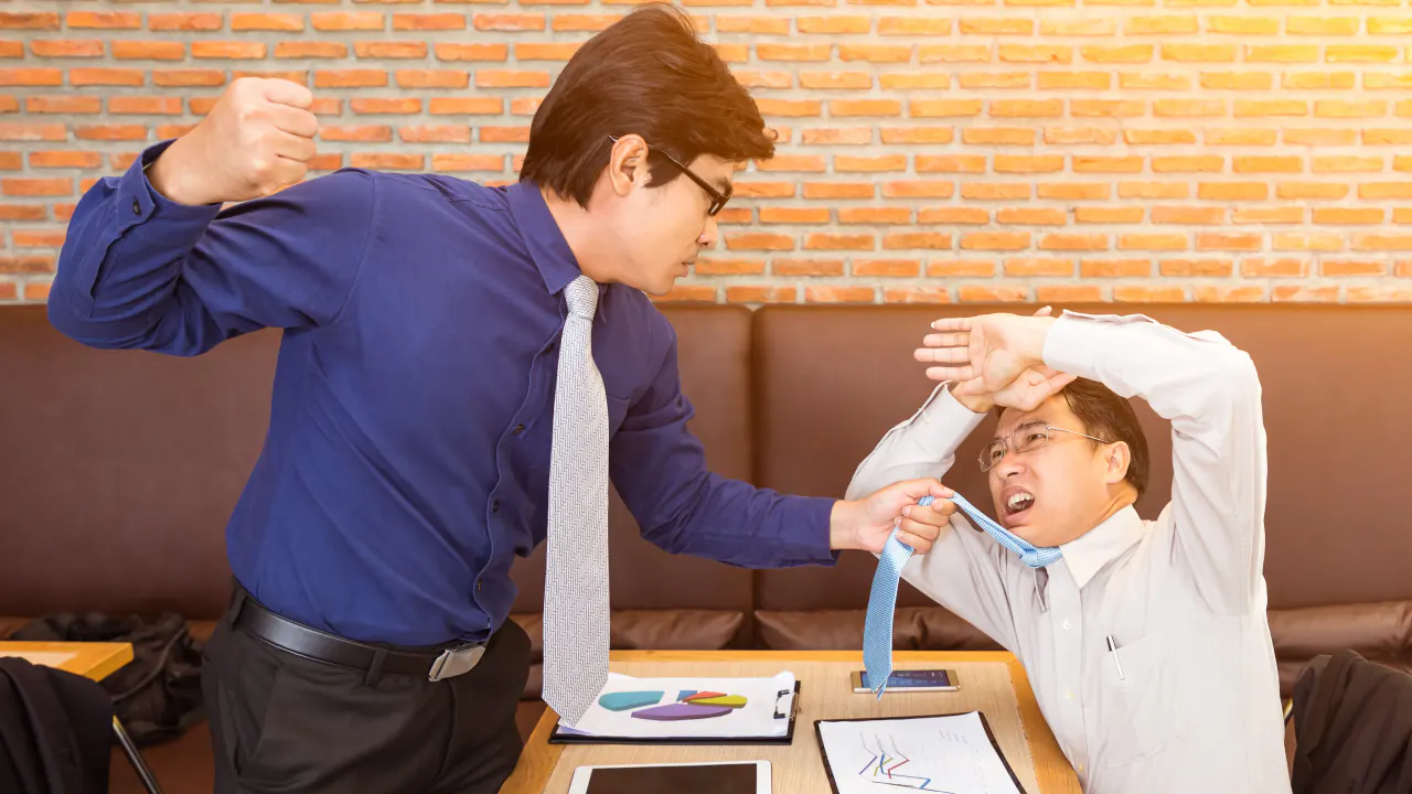 Two businessmen in a tense sales negotiation, illustrating the hard sell approach