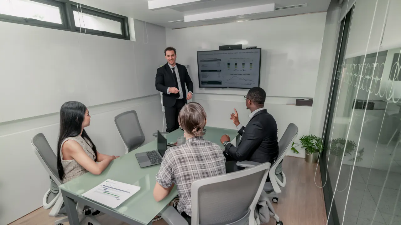 Presenter briefing a team in a conference room, illustrating how B2B lead generation works today