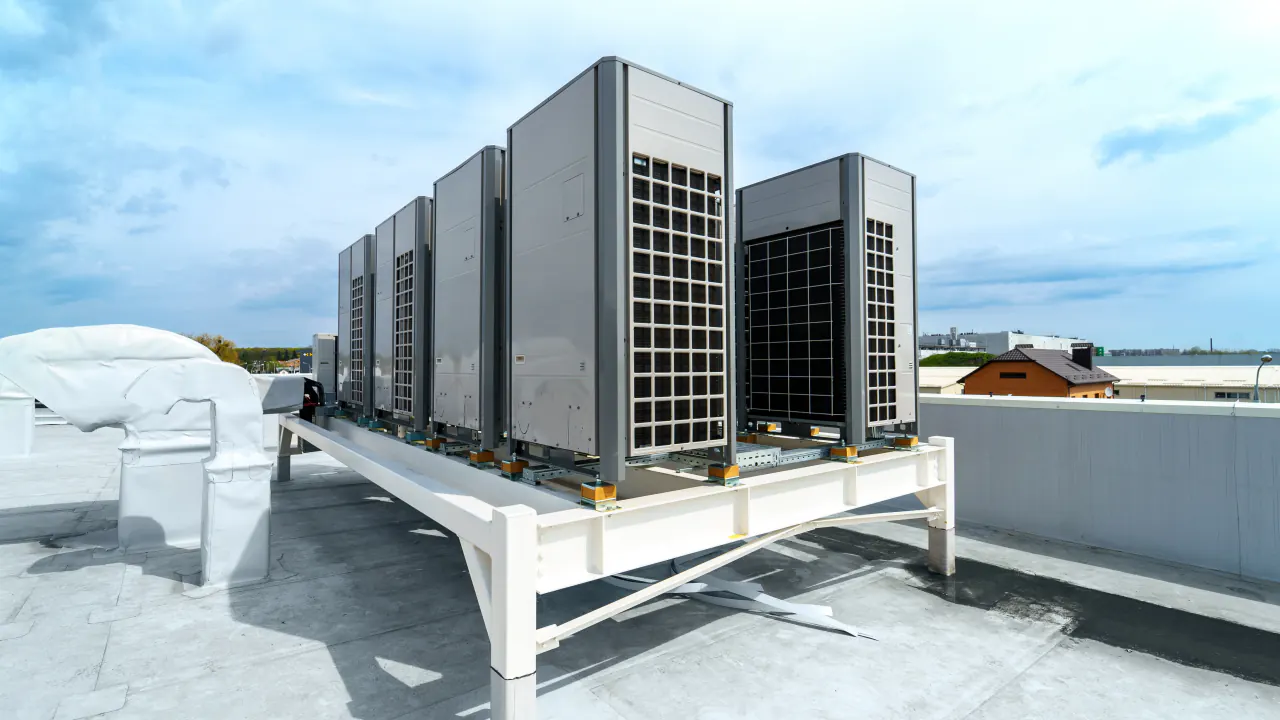 Rooftop commercial HVAC units under a blue sky, illustrating HVAC revenue growth through B2B lead generation