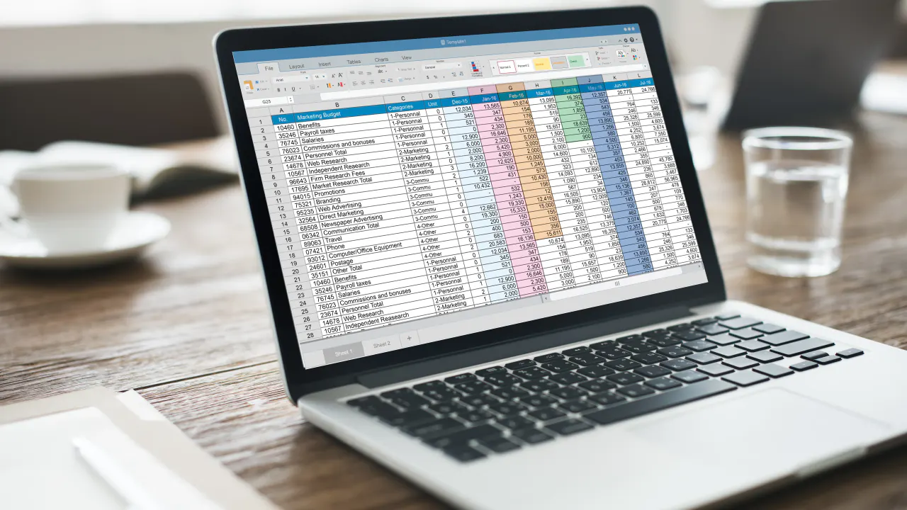 Laptop showing a color-coded lead list spreadsheet, illustrating lead list scraping tools