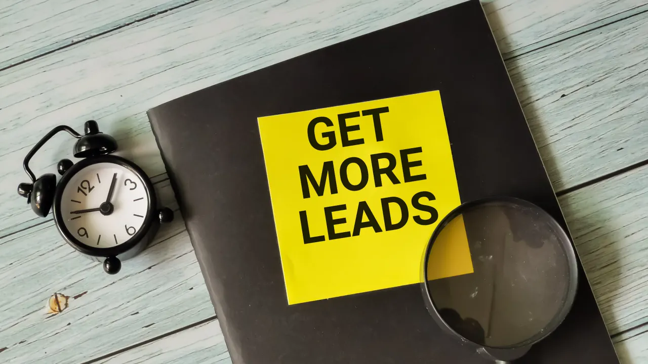 Get More Leads note beside a clock and magnifying glass, illustrating a marketing qualified lead (MQL)