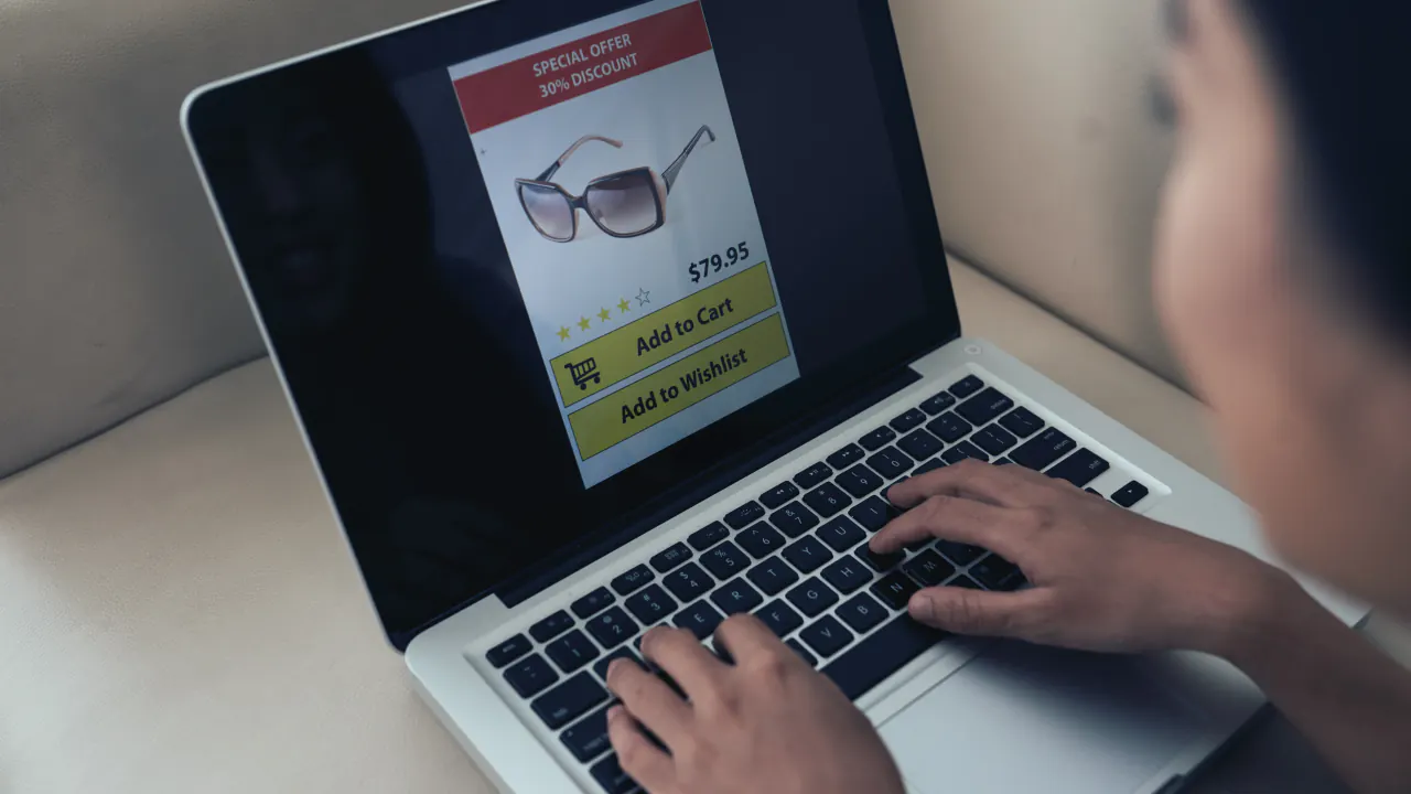 Person browsing a product page on a laptop, illustrating how remarketing works