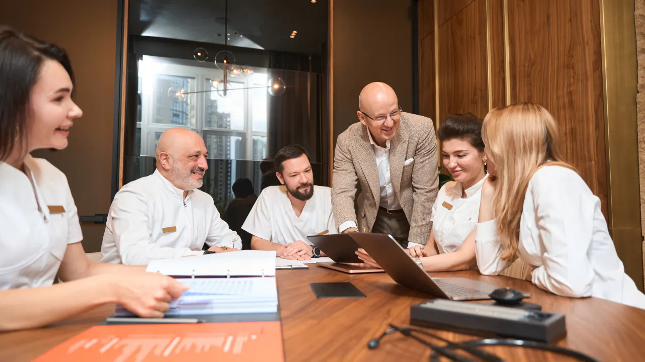 Healthcare executives meeting around a table, illustrating the SST Group healthcare B2B lead generation case study
