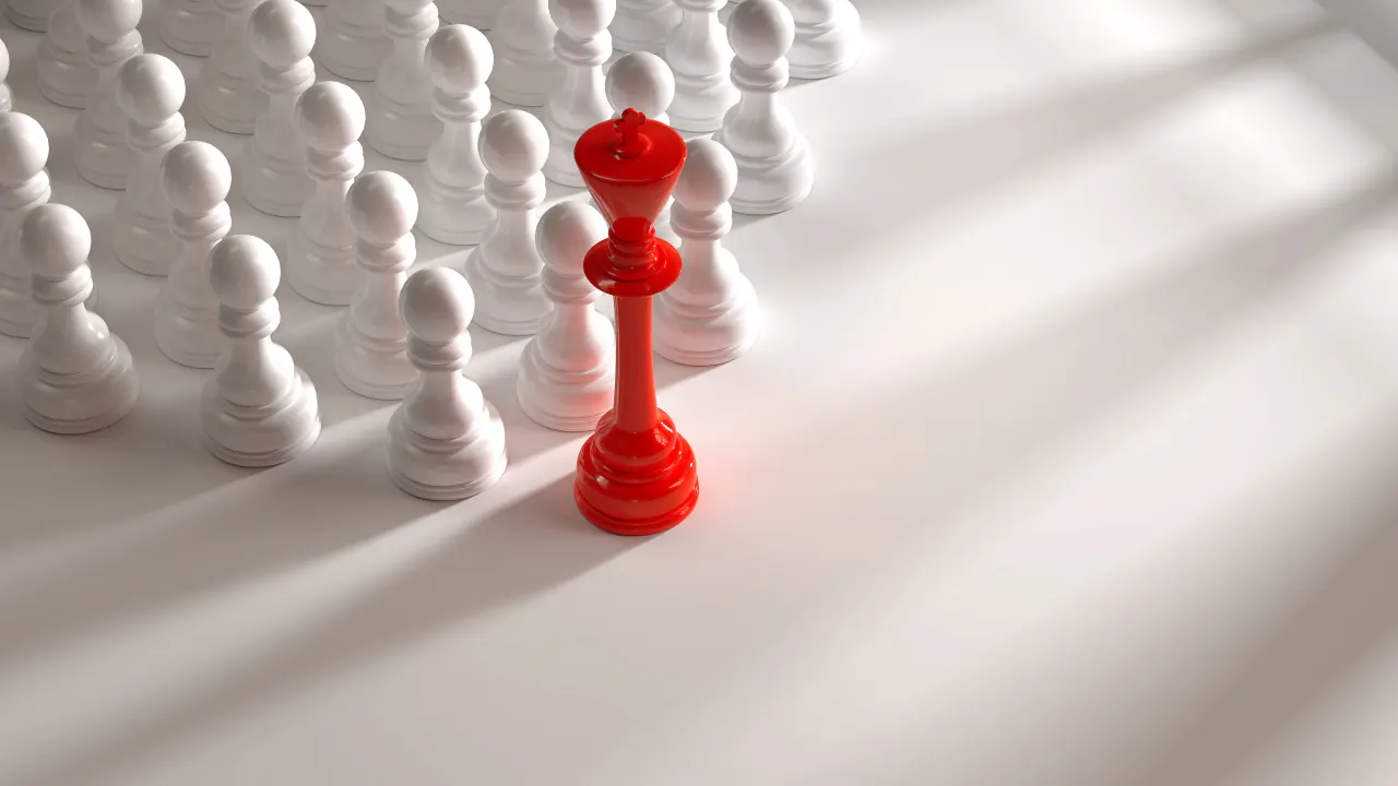 Red chess king standing out among white pawns, illustrating a unique selling proposition