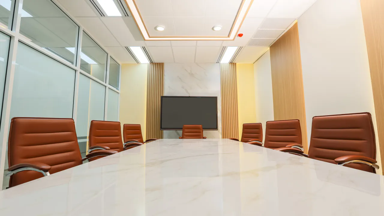 Empty modern conference room with leather chairs, illustrating vanishing B2B appointments