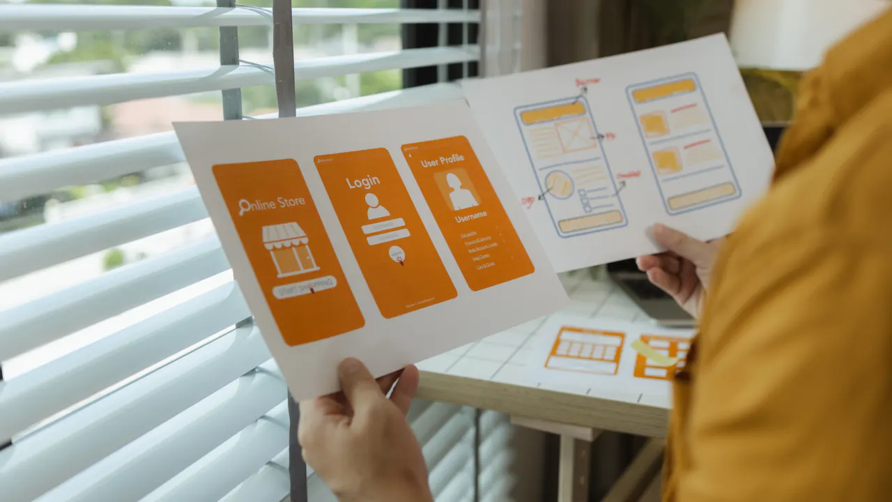 Hands holding printed marketing collateral mockups, illustrating compelling marketing collateral