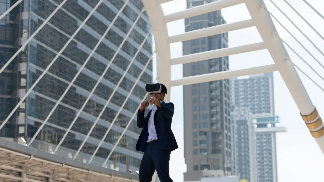 Business professional wearing a VR headset beside city skyscrapers, representing future B2B prospecting techniques